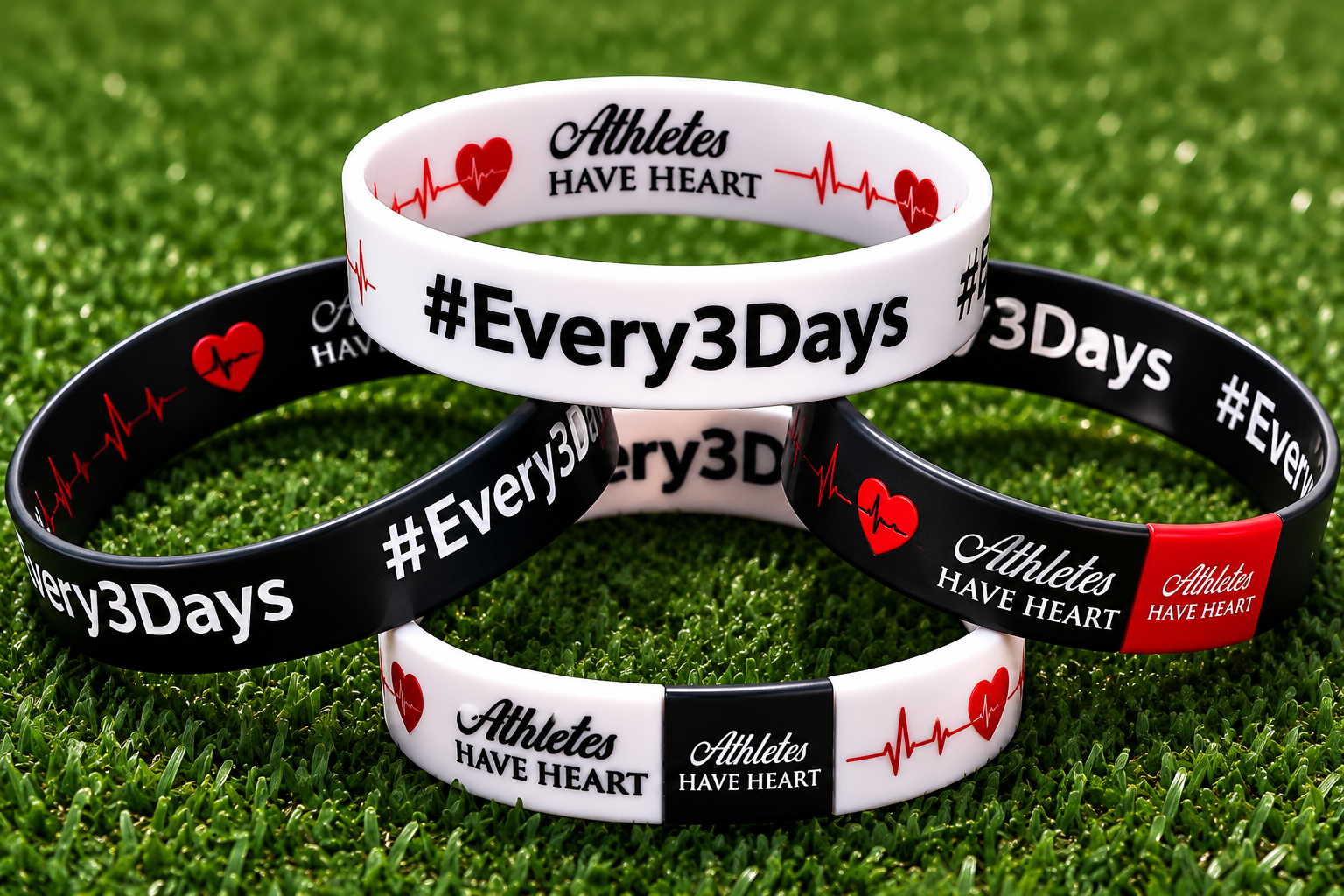 Athletes Have Heart #Every3Days bracelets resting on green turf